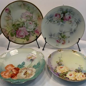 Set of four hand painted cabinet plates.